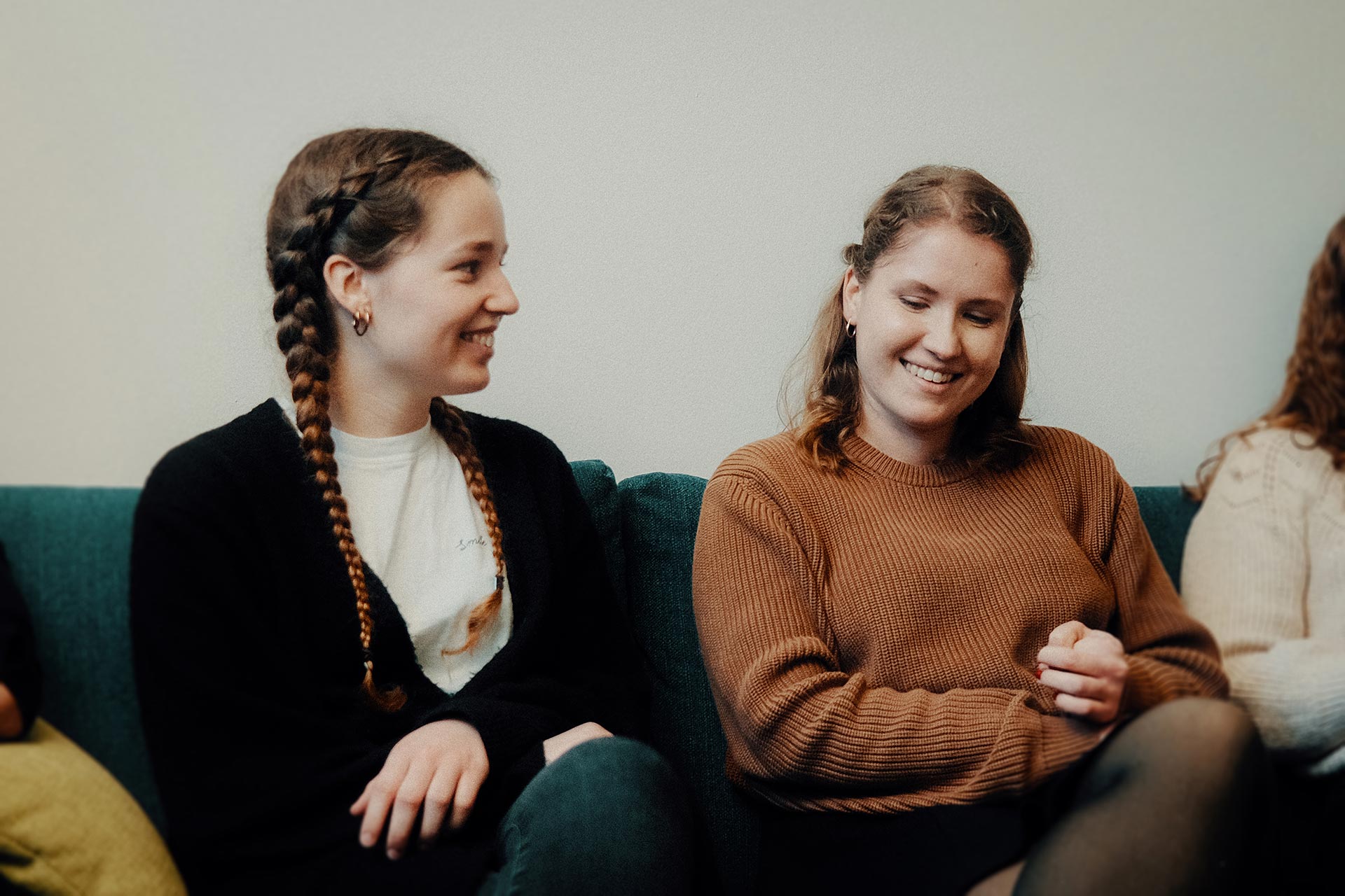 Two female colleagues sitting on a couch